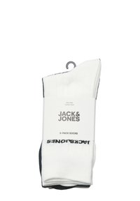 Witte katoenrijke sokken in een 5-pack, met ribbeltextuur en contrasterende donkere accenten. Verpakt met een kartonnen label waarop het merk en de maat staan.