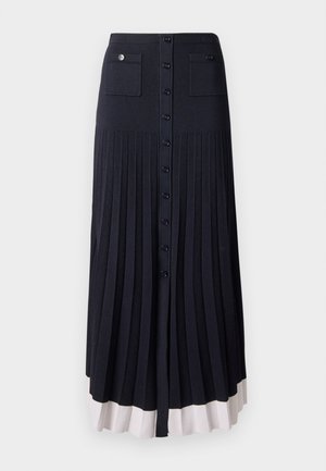 Pleated maxi-hame tumman laivaston sinisen värisenä nappikiinnityksellä. Sisältää kaksi etutaskua ja vaalean värisen helman. Valmistettu pehmeästä, teksturoidusta kankaasta.