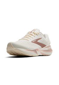 Beižas sporta apavi ar teksturētu sietveida virsu, rozā akcentiem uz sāniem un papēža, kā arī ar mīkstu zoli komfortam un atbalstam.