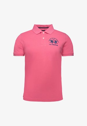 Pink polo shirt made of cotton, featuring a collar, two buttons, and an embroidered logo in blue. Short sleeves and side slits at the hem.