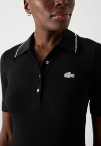 Lacoste Dzsörzéruha - black