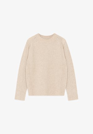 Heledad helebeeg žišik, mis on valmistatud pehmest kudumist. Omab ümarat kaelust, soonikserva ja raglanvarrukaid, millel on peen tekstuur.