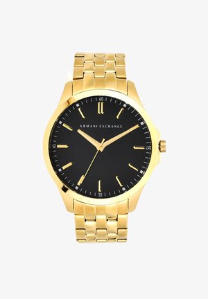 Montre-bracelet dorée avec un cadran noir, dotée d'index et d'aiguilles dorés, d'un bracelet en maillons argentés et d'un design minimaliste.