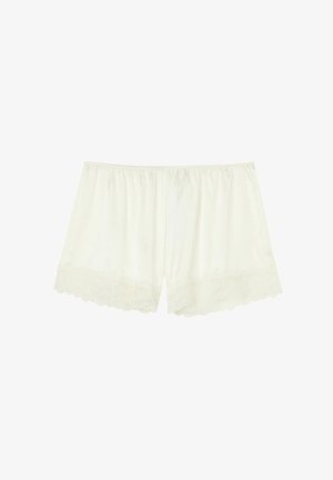Szorty w kolorze kremowym, ozdobione koronką, wykonane z miękkiego materiału, o luźnym kroju i falbankowym wykończeniu dla dodatkowej tekstury i detali.