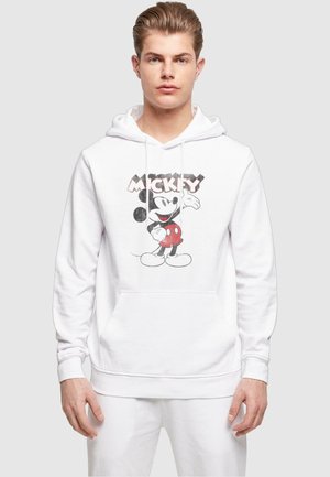 White hoodie featuring a front graphic of Mickey Mouse with a red polka dot shorts design. Includes a kangaroo pocket and drawstring hood.
