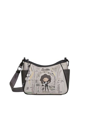 Borsa a tracolla con lati grigio scuro, che mostra una ragazza dei cartoni animati che canta con un gatto, note musicali e il testo "Sing your soul."