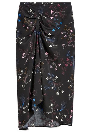 Jupe midi noire avec un nœud torsadé à l'avant, présentant un motif floral multicolore et de branches en rose, bleu, blanc et accents bruns.