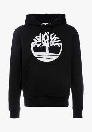 Sweat à capuche noir avec poche avant et logo arbre blanc dans un cercle sur la poitrine, avec cordons à embouts métalliques.