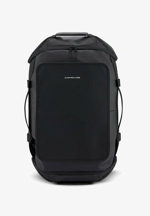 Sac à dos rectangulaire noir avec une poignée supérieure et des sangles latérales, avec le logo Kapten & Son sur la poche avant.
