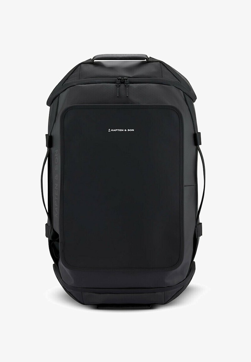 Sac à dos rectangulaire noir avec une poignée supérieure et des sangles latérales, avec le logo Kapten & Son sur la poche avant.