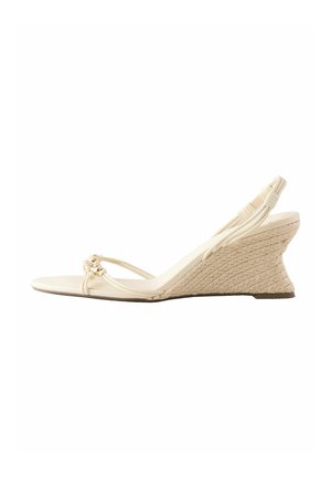 Beige wedge sandal with braided jute heel, thin knotted front straps, and an elastic slingback strap.