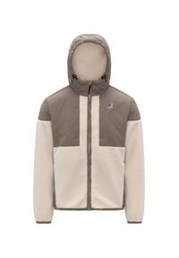 Giacca foderata in pile con una combinazione di colori beige e crema. Presenta un cappuccio, chiusura a zip e un design con pannelli distintivi. Include un dettaglio del logo.