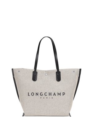 Gray fabric tote bag with black leather handles and accents. Features "LONGCHAMP PARIS" logo printed in bold black letters.