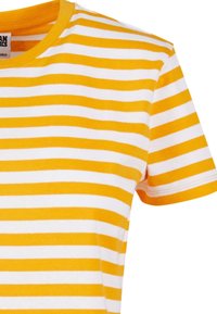 Yellow and white striped short-sleeve T-shirt with a rounded neckline. The fabric appears soft with a smooth texture, featuring neat stitching.