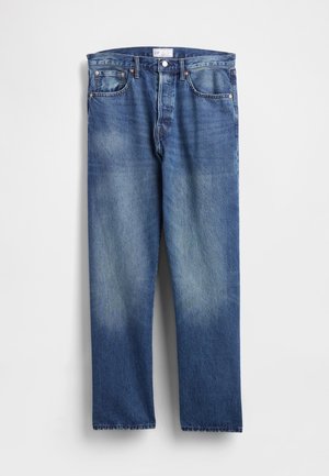 Sinised teksapüksid sirgete sääreosadega, esiküljel tuhmumisega, klassikalise viie tasku kvaliteediga ning taskutel metallnööpnõeltega.