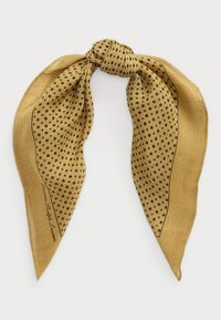 Gold scarf made of lightweight fabric, featuring a polka dot pattern and a black border. Tied in a knot at the top for easy styling.