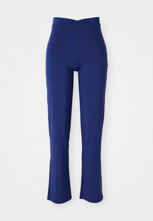 Pantaloni svasati blu navy con vita elasticizzata. Realizzati in un tessuto morbido, presentano un design incrociato davanti in vita.