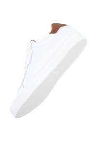 White sneaker with smooth leather upper, brown leather heel accent, and textured rubber sole. Features lace-up closure and minimalist design.