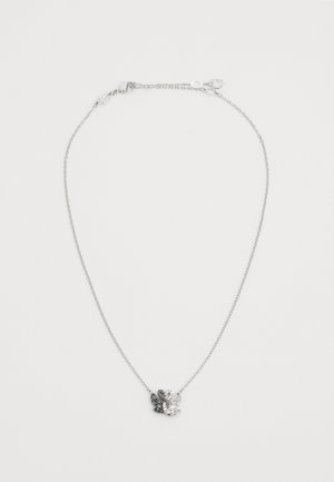 Delicate silver chain necklace with a dual-tone black and clear crystal swan pendant against a plain white background.