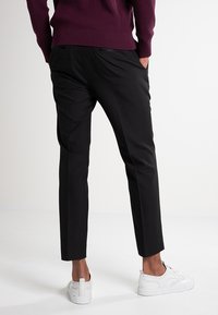 Next Trousers - Suit Trousers  Slim Fit - Öltönynadrág - black