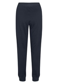 Námořnické modré tepláky vyrobené z měkkého materiálu, s tapered střihem a žebrovanými manžetami na kotnících, se elastickým pasem.