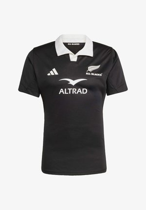 Schwarzes Rugby-Trikot mit weißem Kragen, versehen mit dem All Blacks-Logo und dem in Weiß gedruckten Sponsor "ALTRAD". Hergestellt aus strukturiertem Stoff.