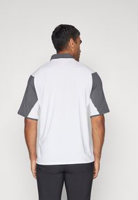 Oakley REDUCT ECHO - Poloshirts - uniform grey