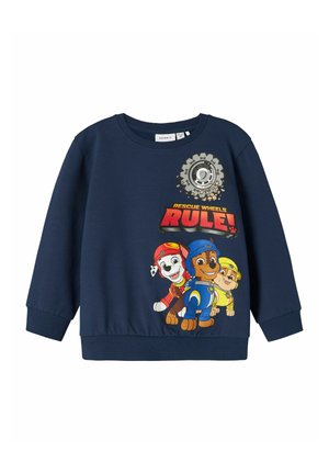 Sweatshirt marine en mélange de coton avec des personnages de chiens cartoonesques et le texte "LES ROUES DE SAUVETAGE SONT LA LOI !" en couleurs vives. Poignets côtelés.