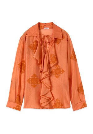 Blusa arancione a maniche lunghe con fronte arricciato, scollo con laccio e motivi floreali testurizzati sparsi su maniche e corpo.