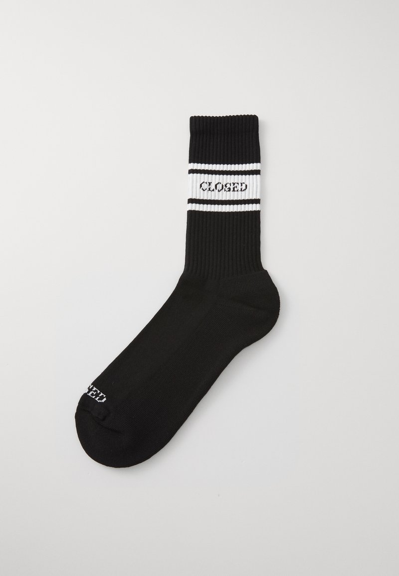 Black cotton sock with ribbed texture, contrasting white stripes featuring "CLOSED" text, mid-calf length, and rounded toe.