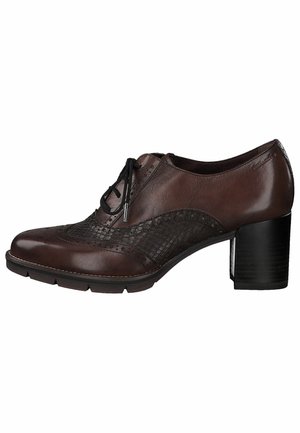 Chaussure femme en cuir marron à lacets, avec côté texturé, détails brogue et talon bloc.