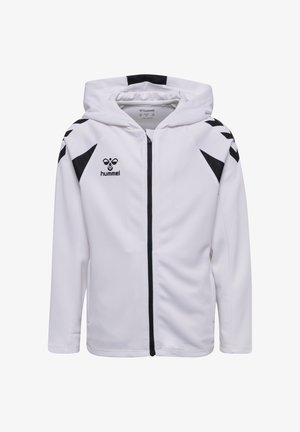 Hvid hættetrøje med lynlås med sorte chevronmønstre på skuldrene, sort lynlås og sort "hummel"-logo på brystet.