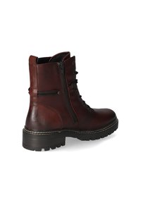 Bottine en cuir brun avec une fermeture éclair sur le côté, un laçage à l'avant, une surface texturée, une semelle extérieure robuste et des détails de couture blanche contrastante.