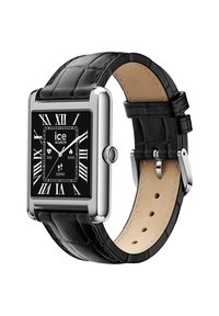 Czarny skórzany pasek zegarka z prostokątną srebrną kopertą, czarną tarczą, cyframi rzymskimi i teksturowanym wykończeniem. Posiada boczną koronkę.
