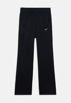 Black athletic pants with an elastic waistband, side pockets, and white Nike logo on the left thigh. Smooth fabric and straight-leg design.