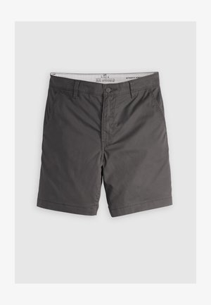 Pilkos chino šortai, pagaminti iš lengvos medžiagos, su plokščiu priekiu, šoninėmis kišenėmis ir mygtuko užsegimu. Standartinė kraštinė su minimalia tekstūra.