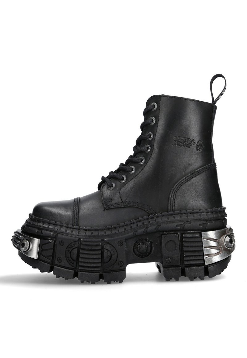 Black leather combat boot with high top, round toe, thick textured sole, silver hardware accents, and distinctive tread pattern.