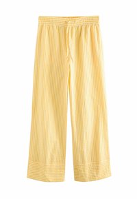 Pantalons larges rayés jaunes avec une taille élastique et un cordon de serrage. Le tissu présente une texture lisse et des rayures blanches contrastantes.