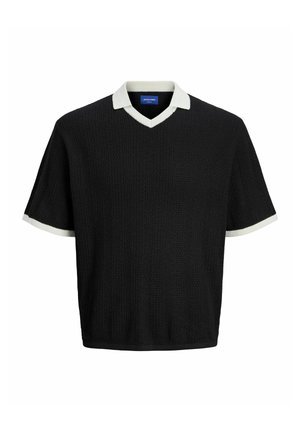 Pull noir à manches courtes avec un col en V, présentant un motif texturé. Bordures blanches aux cols et aux manches.