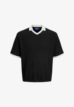 Pull noir à manches courtes avec un col en V, présentant un motif texturé. Bordures blanches aux cols et aux manches.