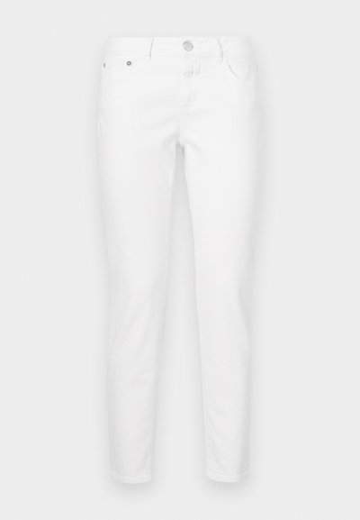 Valged kitsad teksad, valmistatud puuvillase segukangast. Omavad viit taskut, lukuga ja metallist nupuga sulgemist.