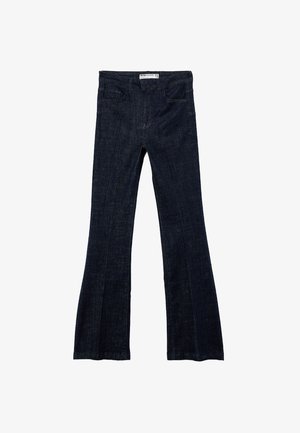 Dark blue denim jeans with a flared leg design, front pockets, and a waistband with belt loops, laid flat on a white background.