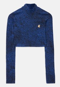 Cropped long-sleeve top in blue with a textured pattern. Features a mock neck and a gold emblem accent on the chest. Soft fabric.