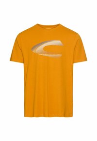 Orange bomulds-T-shirt med et stort sølvfarvet grafisk logo på forsiden. Korte ærmer og klassisk rund halsudskæring.