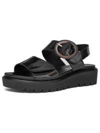 Black patent leather sandal with chunky sole, open toe, wide front strap, and large round buckle on ankle strap.