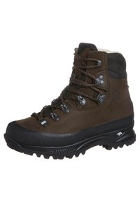 Καφέ δερμάτινη μπότα πεζοπορίας με μαύρη καουτσούκ σόλα, μεταλλικές θηλιές, επενδεδυμένο κολάρο στον αστράγαλο και παχύ πέλμα για εξωτερική χρήση.