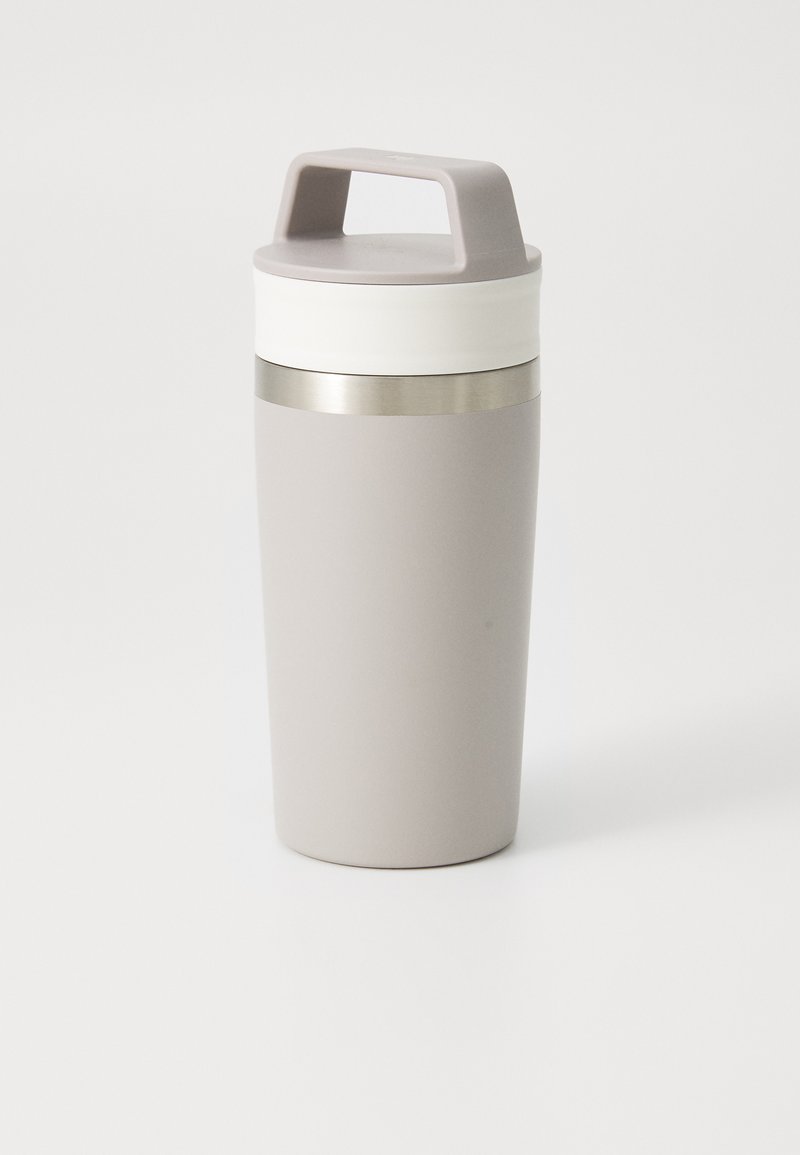 Gray insulated travel mug with a textured body, white silicone band, and a gray plastic lid featuring a handle. Stainless steel accent band.