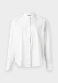 Camicia bianca a maniche lunghe con colletto a banda, dotata di chiusura con bottoni e taschino sul petto. Realizzata in un tessuto leggero, dalla texture liscia.