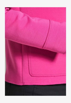 Fitted pink sweatshirt with a smooth texture, featuring a ribbed sleeve cuff and a rectangular pocket detail on the front.