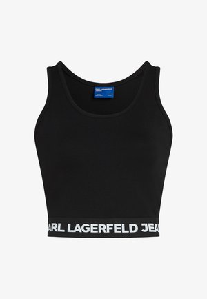 Svart avkortet tank top laget av elastisk stoff med rund halslinning og et bredt, hvitt merkeband i elastikk nederst.